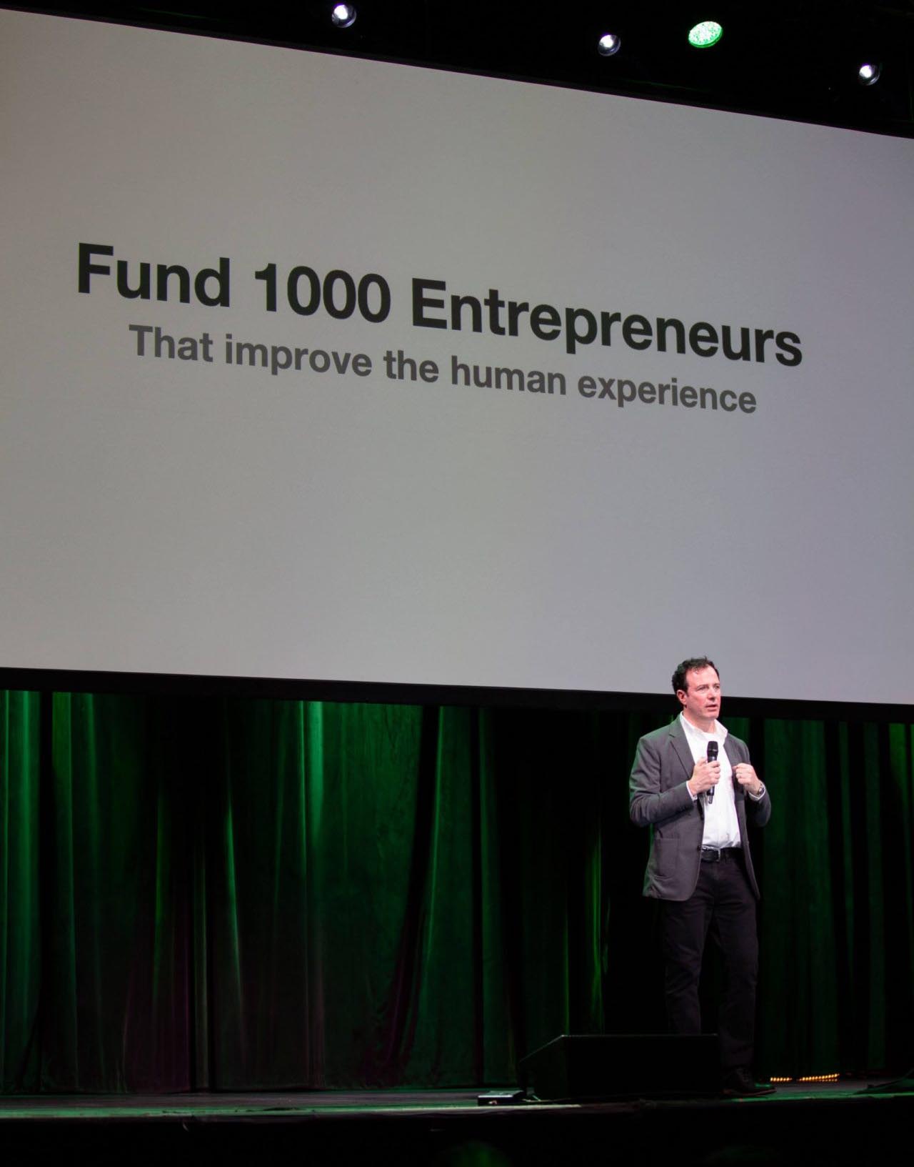 Fund 1000 Entrepenours - Greg Raiz speaking from stage